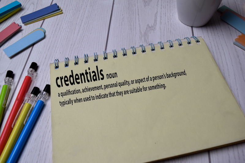 Definition of Credentials word with a meaning on a book. dictionary concept