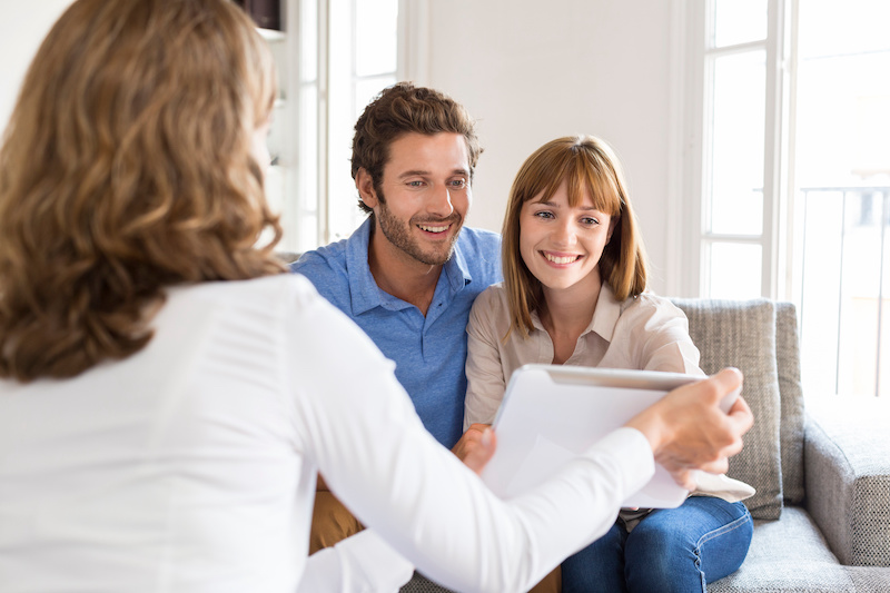 young couple meeting with financial planner