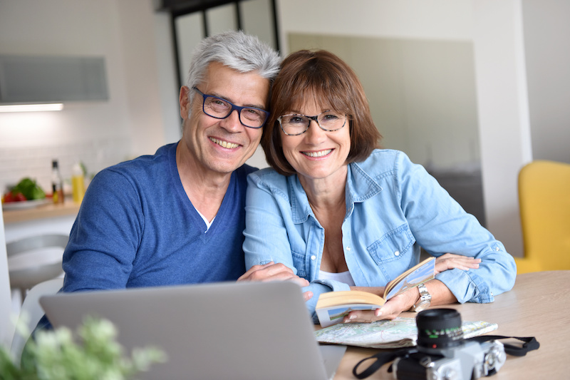 Senior couple preparing vacation trip