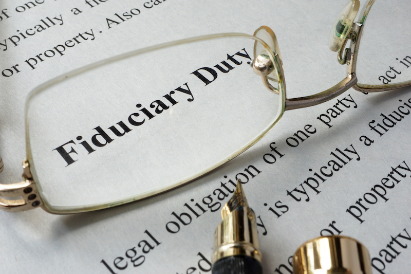 Fiduciary duty concept written on a paper