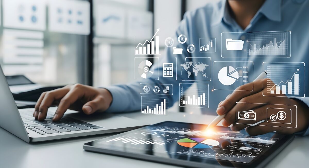 Financial professional analyzing investment dashboards and tax planning data on a tablet and laptop for wealth management and tax-efficient strategy in Buffalo Grove, IL.