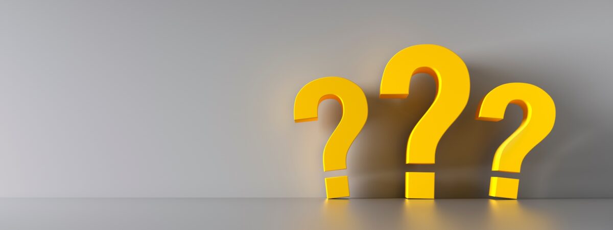 Three yellow question marks on a neutral background representing key decision factors around Roth conversion timing, tax planning strategies, and retirement income considerations for investors in Buffalo Grove and the Chicago area.
