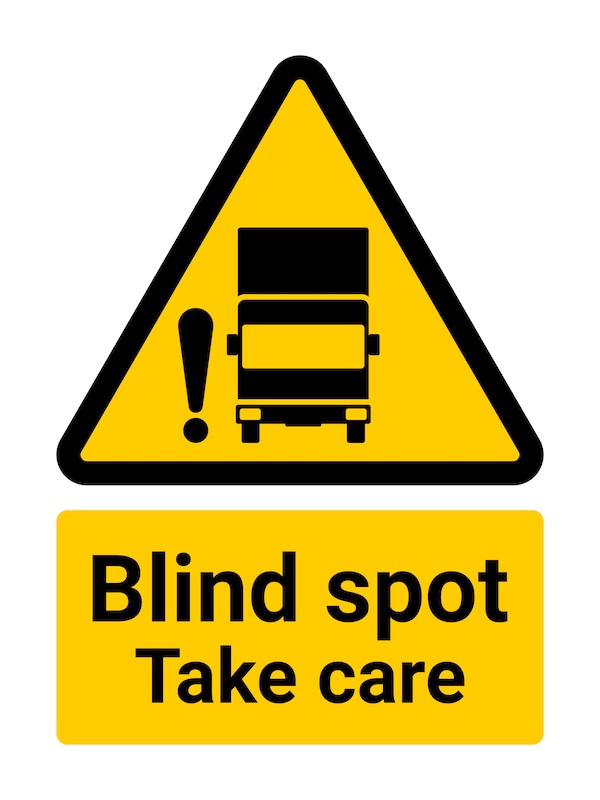 Blind spot warning road sign with truck icon, symbolizing overlooked risks in retirement insurance planning, including gaps in coverage, outdated policies, and loss of employer benefits for retirees in Buffalo Grove and the Chicago area.