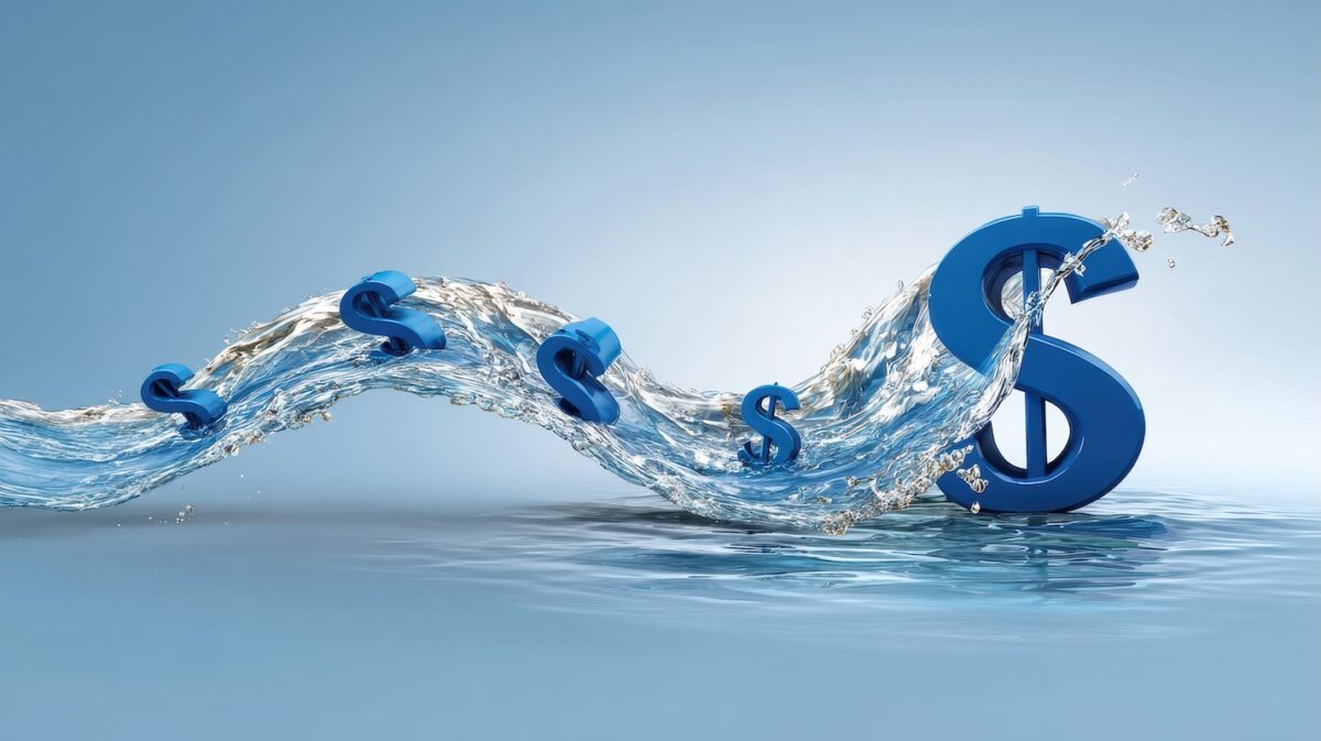 Dollar signs flowing through water, representing retirement liquidity and how much cash retirees should keep available for retirement expenses.